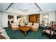 Common area with wicker furniture, a wood coffee table, and built-in shelving at 800 S Dakota Ave # 329, Tampa, FL 33606