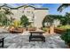 Outdoor patio area with seating, landscaping, and building view at 800 S Dakota Ave # 329, Tampa, FL 33606