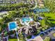 Aerial view of community pool, playground, tennis courts, and other neighborhood amenities at 8030 Hampton Lake Dr, Tampa, FL 33647