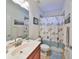 Simple bathroom with shower/tub combo and wood vanity at 8030 Hampton Lake Dr, Tampa, FL 33647