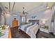 Main bedroom with dark hardwood floors and ceiling fan at 8030 Hampton Lake Dr, Tampa, FL 33647