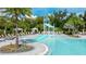 Relaxing pool area with water slide and shaded seating at 8250 Velda Trl, Sarasota, FL 34241