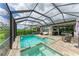 Relaxing screened-in pool and spa with outdoor seating at 8250 Velda Trl, Sarasota, FL 34241