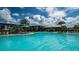 Large resort-style pool with plenty of lounge chairs at 8250 Velda Trl, Sarasota, FL 34241