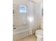 Bathroom with a shower/tub, tile flooring, and window at 8368 Miramar Way # 21, Lakewood Ranch, FL 34202