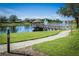 Lakeside gazebo with a wooden dock and walkway at 8368 Miramar Way # 21, Lakewood Ranch, FL 34202