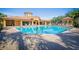 Resort-style pool with plenty of lounge chairs and a clubhouse at 8368 Miramar Way # 21, Lakewood Ranch, FL 34202