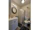 Bathroom features a shower, toilet, and white vanity at 8585 Cristobal Avenue, North Port, FL 34287