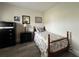 Small bedroom with twin bed, dresser, and wood floors at 8585 Cristobal Avenue, North Port, FL 34287