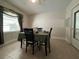 Bright dining room features a table set for four and tiled floors at 8585 Cristobal Avenue, North Port, FL 34287