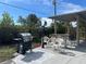 Outdoor patio with seating area, grill, and covered pergola at 8585 Cristobal Avenue, North Port, FL 34287