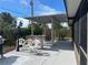 Spacious patio with covered seating area and a pergola at 8585 Cristobal Avenue, North Port, FL 34287