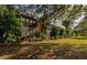 Building exterior nestled amongst tropical foliage at 936 La Costa Cir # 4, Sarasota, FL 34237