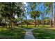 Landscaped community lawn with walking paths at 936 La Costa Cir # 4, Sarasota, FL 34237