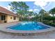 Inviting community pool with lounge chairs at 936 La Costa Cir # 4, Sarasota, FL 34237