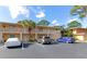 Two-story building with ample parking and tropical landscaping at 936 La Costa Cir # 4, Sarasota, FL 34237