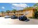 Building exterior featuring parking and landscaping at 936 La Costa Cir # 4, Sarasota, FL 34237