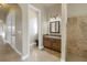 Bathroom featuring a tiled shower stall, toilet, and granite countertop vanity at 9709 Wilderness Trl, Weeki Wachee, FL 34613