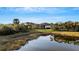 Backyard with pond view, showcasing the tranquil setting at 5341 Greenbrook Dr, Sarasota, FL 34238