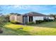 House exterior and backyard, highlighting the screened patio and lawn at 5341 Greenbrook Dr, Sarasota, FL 34238