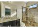 Bathroom with granite vanity, tiled shower, and modern fixtures at 5341 Greenbrook Dr, Sarasota, FL 34238