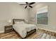 Cozy bedroom with wood floors, ceiling fan, and neutral color palette at 5341 Greenbrook Dr, Sarasota, FL 34238