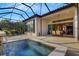 Large covered patio with pool, spa and dining furniture at 5341 Greenbrook Dr, Sarasota, FL 34238