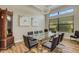 Formal dining room with glass table and chandelier at 5341 Greenbrook Dr, Sarasota, FL 34238