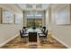 Elegant dining room, glass table, and hardwood floors at 5341 Greenbrook Dr, Sarasota, FL 34238