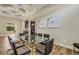 Spacious dining room with glass top table and dark chairs at 5341 Greenbrook Dr, Sarasota, FL 34238