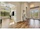 Elegant entry with hardwood floors, chandelier, and views to office at 5341 Greenbrook Dr, Sarasota, FL 34238