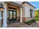 Double entry doors with stone accents and columns at 5341 Greenbrook Dr, Sarasota, FL 34238