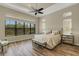 Spacious main bedroom with large windows and hardwood floors at 5341 Greenbrook Dr, Sarasota, FL 34238