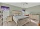 Main bedroom with a large bed, dresser, and nightstands at 10315 Cortez W Rd # 5H, Bradenton, FL 34210