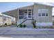 Charming single-Gathering home with a covered carport, front porch and manicured landscaping at 10315 Cortez W Rd # 5H, Bradenton, FL 34210