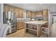 Modern kitchen with stainless steel appliances and an island at 10315 Cortez W Rd # 5H, Bradenton, FL 34210