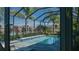 Inviting screened pool and patio overlooking a serene landscape at 10624 Falling Leaf Ct, Parrish, FL 34219