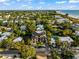 Luxury home with a metal roof, pool, and ocean views at 107 Maple Ave, Anna Maria, FL 34216