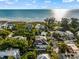 Coastal home with ocean views, situated amongst lush tropical landscaping at 107 Maple Ave, Anna Maria, FL 34216