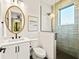 Stylish bathroom with a walk-in shower and white vanity at 107 Maple Ave, Anna Maria, FL 34216