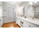 Modern bathroom with double vanity and walk-in shower at 110 46Th St, Holmes Beach, FL 34217