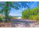 Private beach access path through lush vegetation at 110 46Th St, Holmes Beach, FL 34217