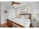 Spacious bedroom with king-size bed, hardwood floors and ceiling fan at 110 46Th St, Holmes Beach, FL 34217