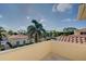 Balcony view of community pool and lush landscaping at 1152 Beachcomber Ct # 15, Osprey, FL 34229