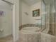 Bathroom boasts a relaxing bathtub and a separate shower at 1152 Beachcomber Ct # 15, Osprey, FL 34229