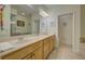 Double vanity bathroom with a large mirror and separate shower and tub at 1152 Beachcomber Ct # 15, Osprey, FL 34229