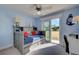 Bedroom with daybed and sliding glass door to balcony at 1152 Beachcomber Ct # 15, Osprey, FL 34229