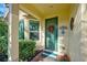 Inviting front door entrance with wreath and nautical decor at 1152 Beachcomber Ct # 15, Osprey, FL 34229