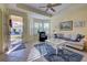 Relaxing living room with a cozy seating area and bay window at 1152 Beachcomber Ct # 15, Osprey, FL 34229