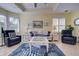 Spacious living room with white couch and blue rug at 1152 Beachcomber Ct # 15, Osprey, FL 34229